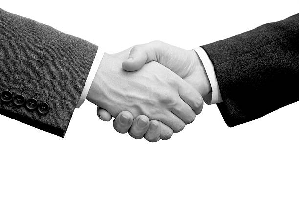 Businessmen handshake (b/w) stock photo