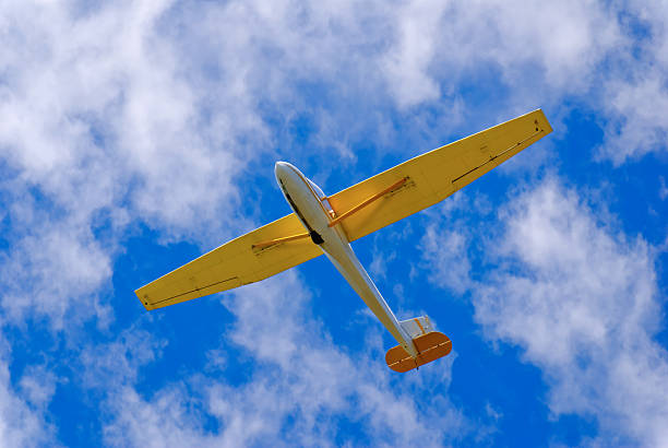 istock Glider or Soar Plane Against a Perfect Blue Cloudy Sky 172188178