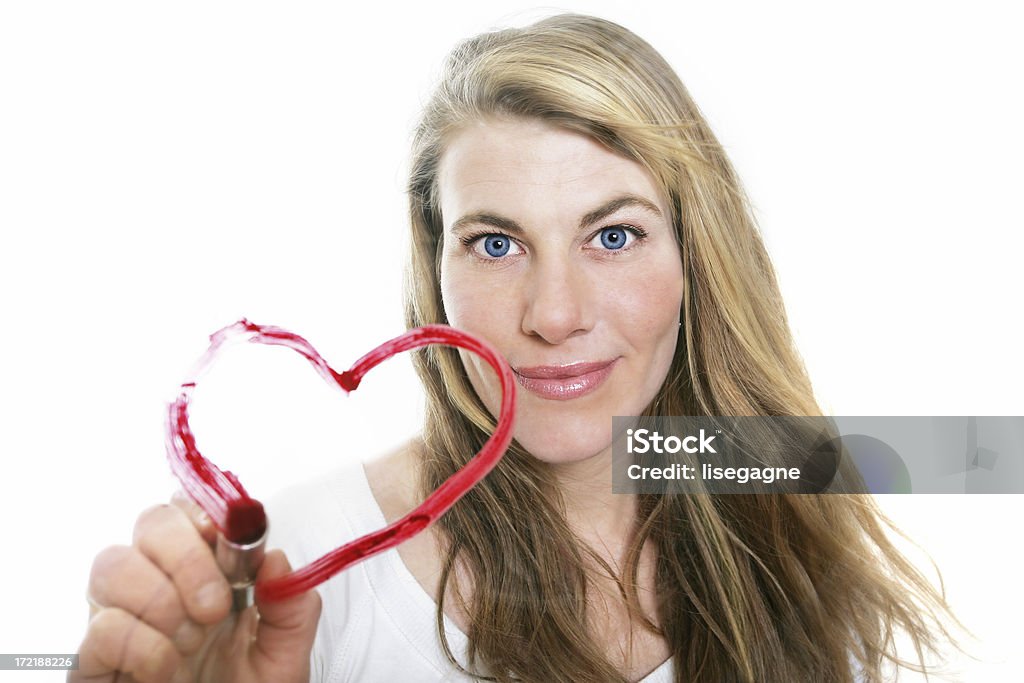 Drawing a heart Woman drawing a lipstick heart on glass. 20-29 Years Stock Photo