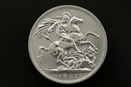 Macro of an old British five shilling silver coin, with St George slaying the dragon.