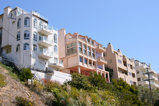 Mansions side by side look like apartment buildings but are single family homes worth over $3,000,000+ in PLaya Del Rey,CA overlook ocean on coastal bluff 