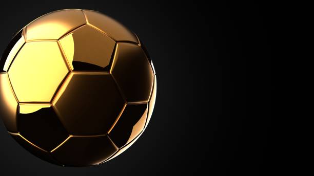 istock Gold soccer ball on black text space. 1721886823