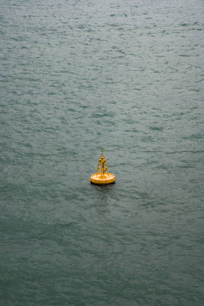 istock Yellow ship navigation beacon on the sea 1721888250