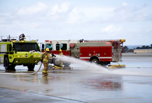 Fire Fighters training in aircraft fire response.