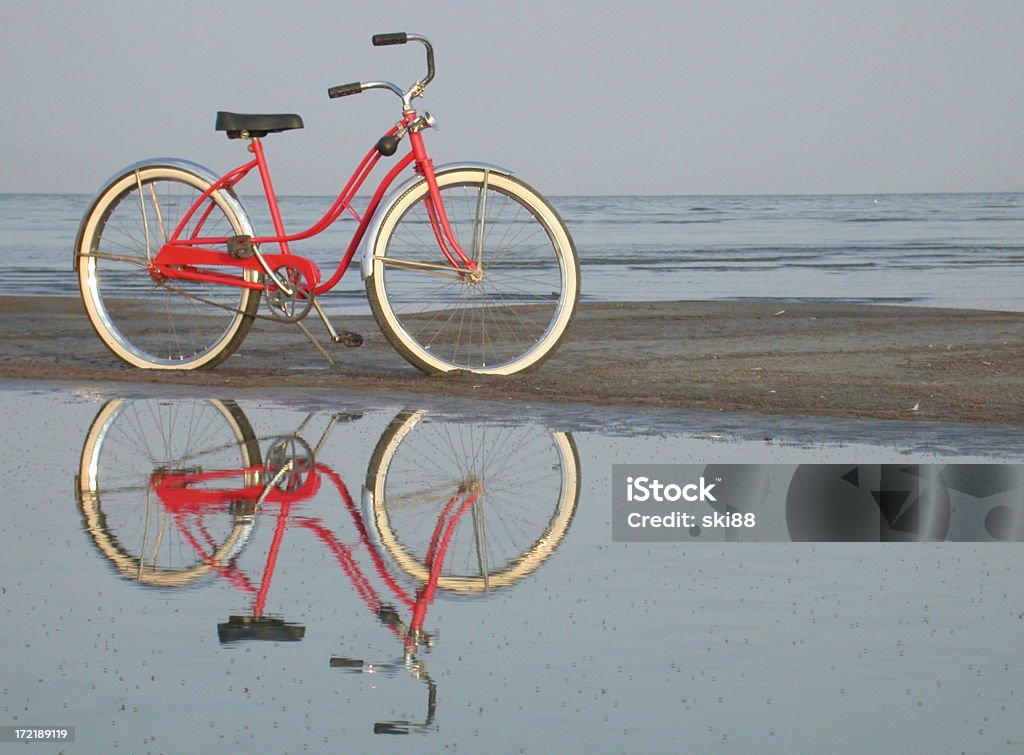 Red Bike Red retro bike on beach. Bicycle Stock Photo