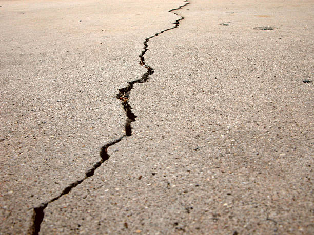 Crack in cement showing DEPTH OF FOCUS and detail of concrete grain.
