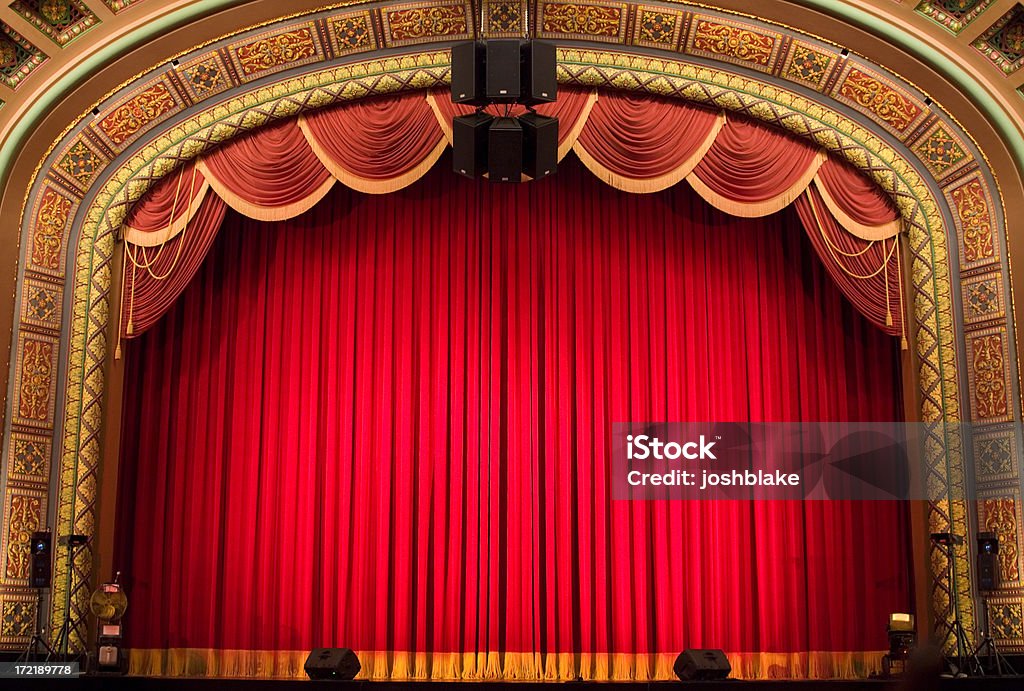Inside the Theatre red curtain on stage Theatrical Performance Stock Photo