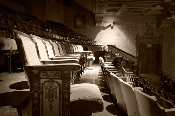 aged seats aged and colorized theater seats...some visible noise. movie theater photos stock pictures, royalty-free photos & images
