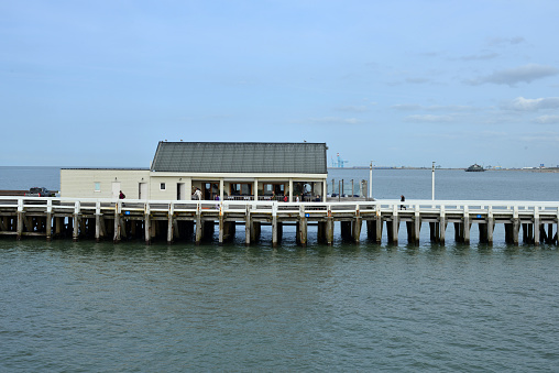 Blankenberge, West-Flanders, Belgium-September 30, 2023: restaurant beach hut on the pier seen from German bridge pier that will be soon demolished for ever