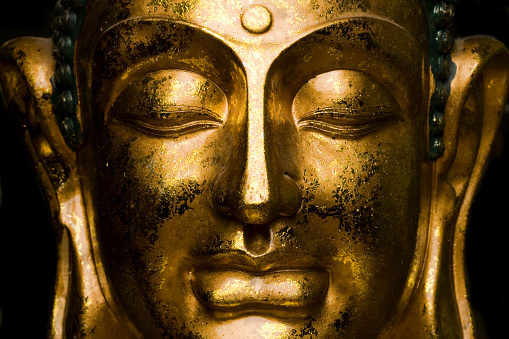 Close up of buddha face. 