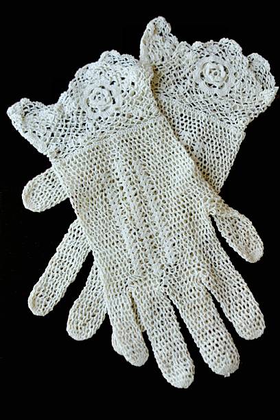 Antique Crocheted Gloves on black background
