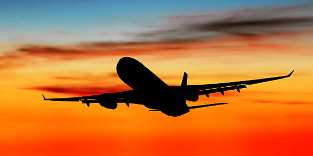 istock jet airplane taking off at dusk 172190791