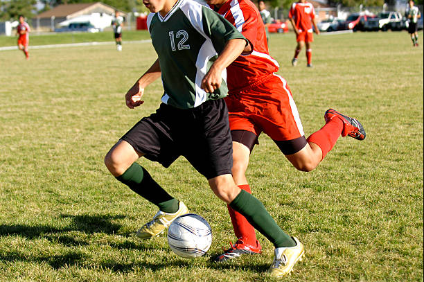 Kicking the ball.