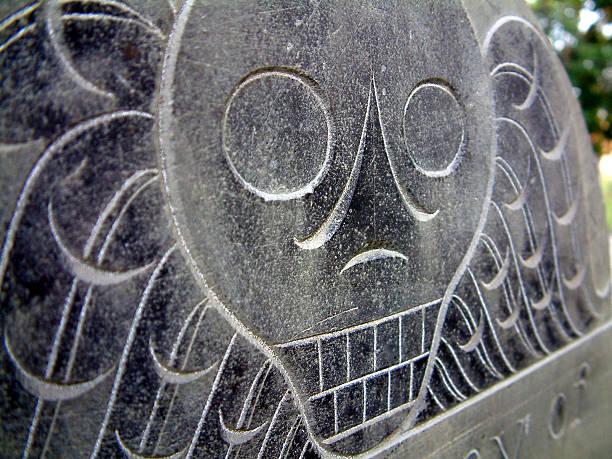 Tombstone Skull Skull engraved on tombstone in Salem MA salem massachusetts stock pictures, royalty-free photos & images