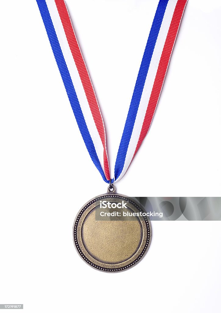 Gold Medal "A gold medal award on a red, white, and blue ribbon." Medal Stock Photo