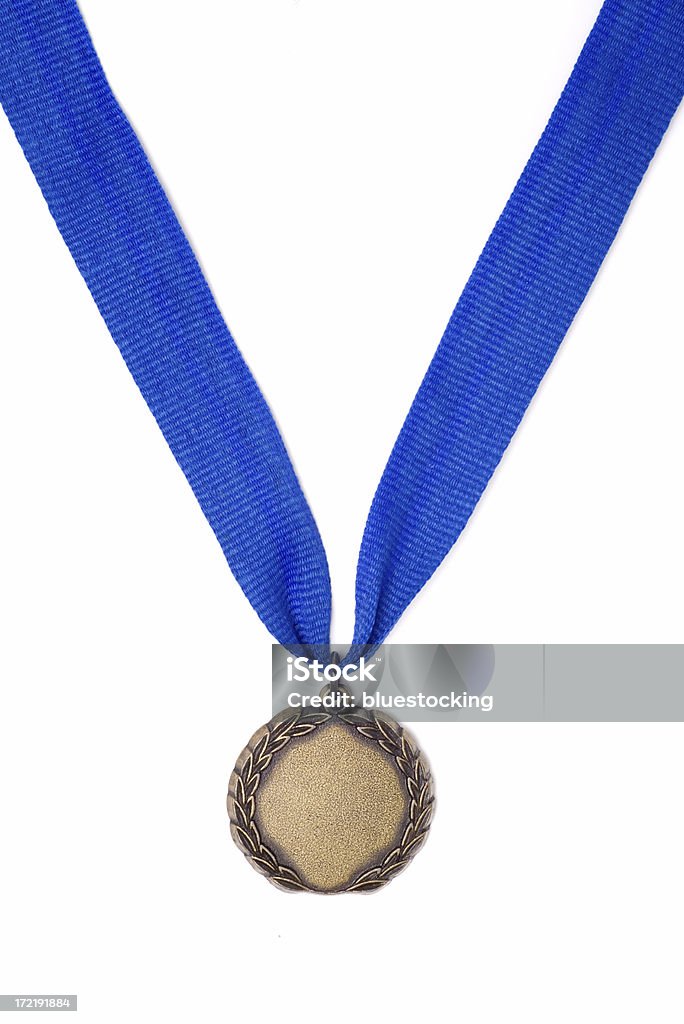 Gold Medal Award on a Blue Ribbon A gold medal award ribbon on a blue ribbon. Award Stock Photo