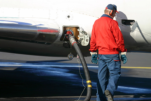 Man tanking the airplane with gasoline