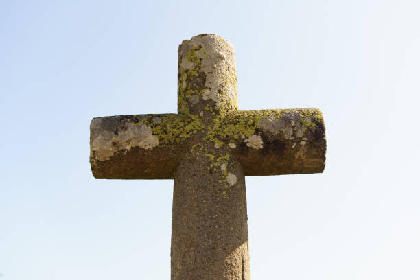 istock An ancient stone cross under a bright blue sky 1721922418