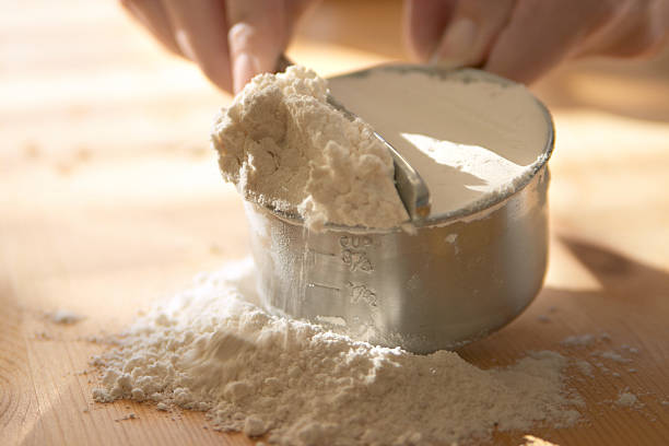 Flour Baking - measuring flour. flour stock pictures, royalty-free photos & images