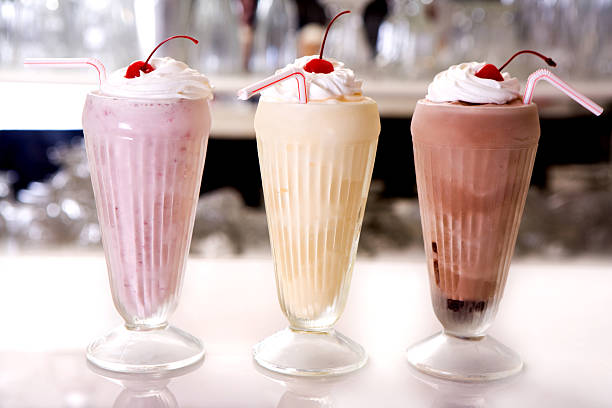 Milkshake trio "A trio of milkshakes. Strawberry, vanilla & chocolate. Ummm." milkshake stock pictures, royalty-free photos & images