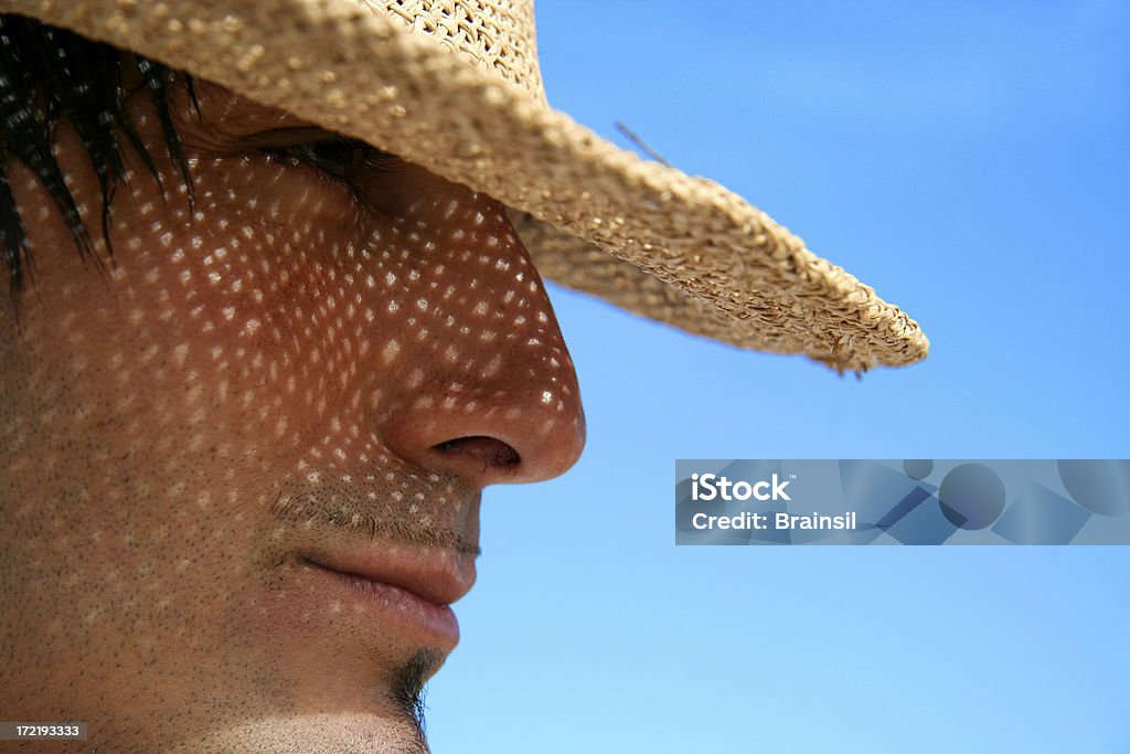 Homem usando um chapéu de palha - Foto de stock de Face Humana royalty-free