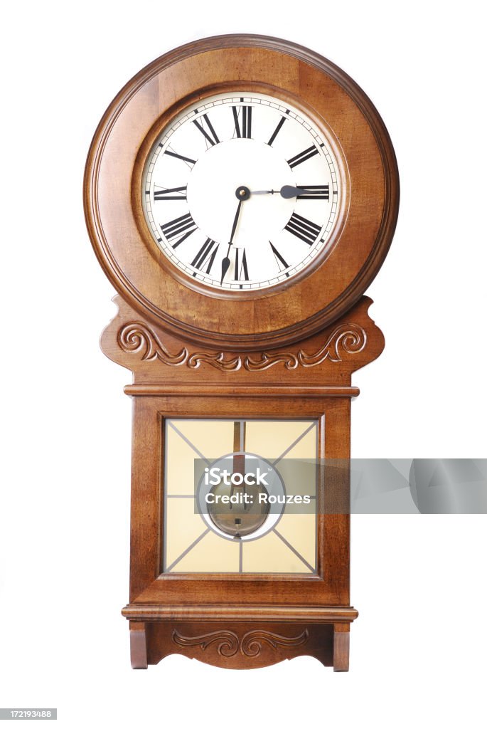 Wall clock An antique clock isolated on white Antique Stock Photo