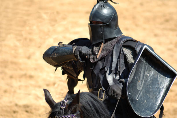 Attack of the knight A knight ready to attack the enemy. black knight stock pictures, royalty-free photos & images