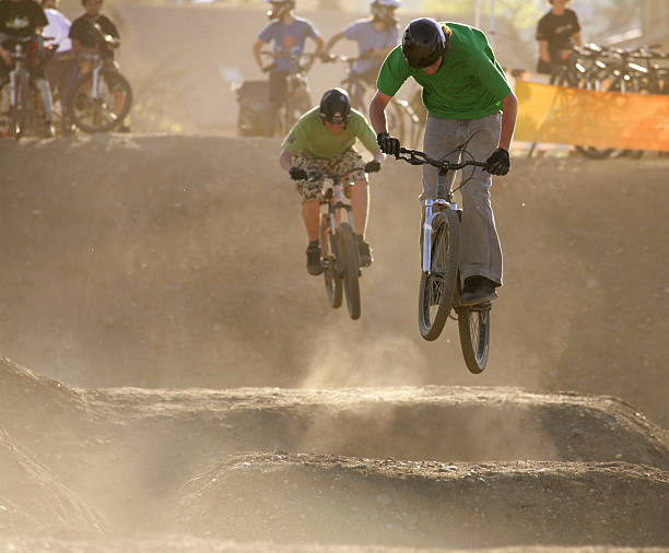 Jumping Bmx jumping action. bmx racing stock pictures, royalty-free photos & images