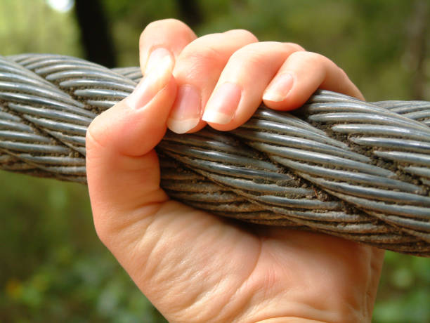 Hold On! This rope is huge! uncompromising stock pictures, royalty-free photos & images