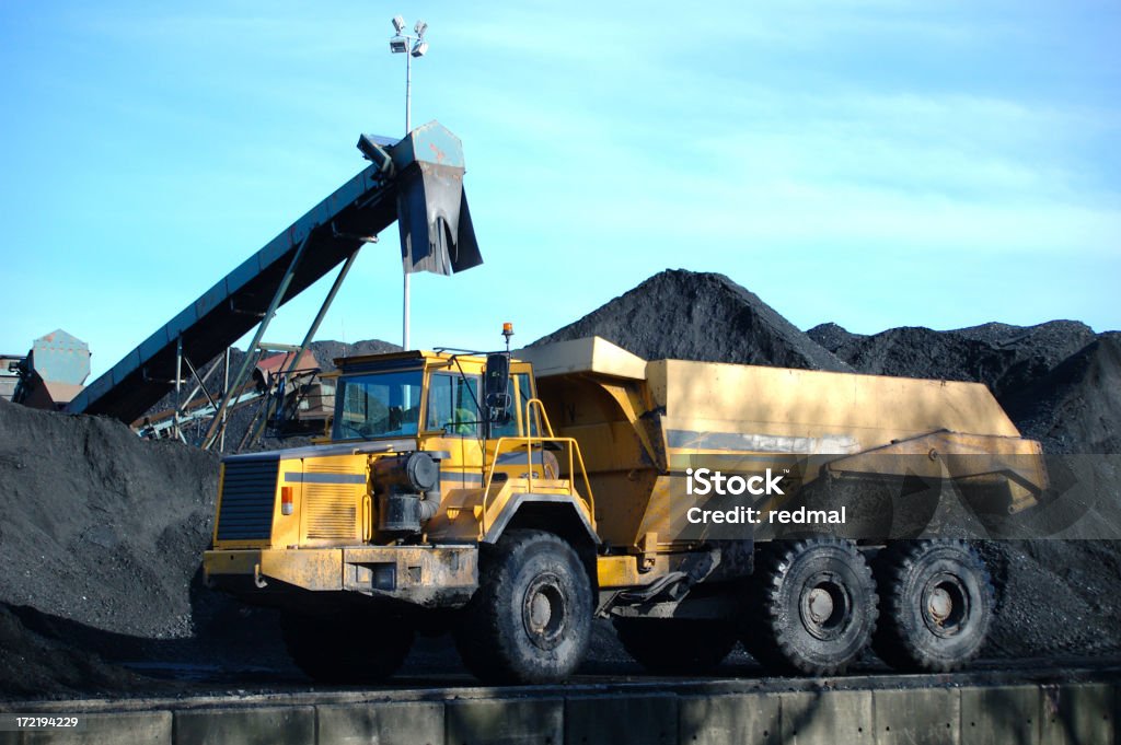 coal truck large truck at coal mine waiting to be filled.trucks and mining lightbox Backhoe Stock Photo