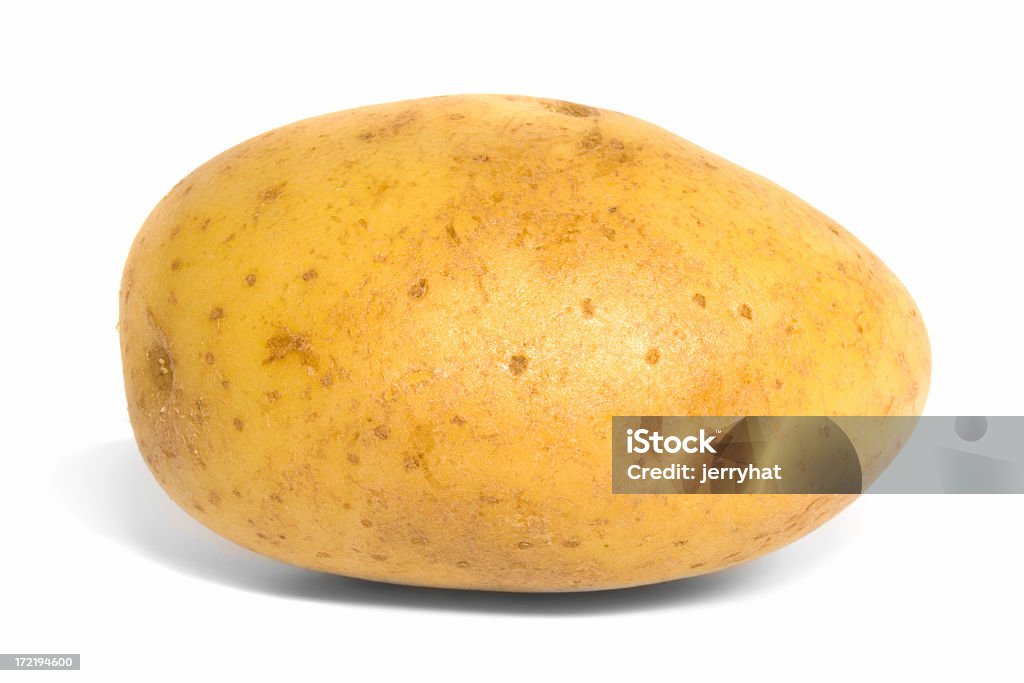 Side view of a baking potato against a white background "A baking potato, shot from the side." Raw Potato Stock Photo