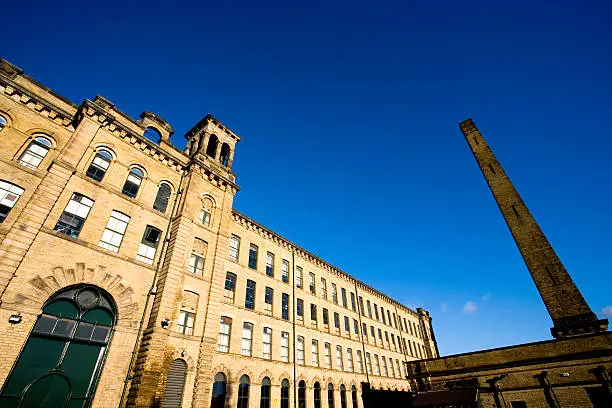 "The old victorian textile mills and canal in Saltaire, Yorkshire, England.  Built by Sir Titus Salt at the time it was the largest industrial building in the world. Now offices, apartments and an art gallery."