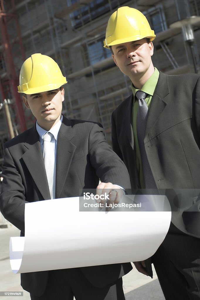 Dois com o líder do projeto de construção de site - Foto de stock de Acordo royalty-free