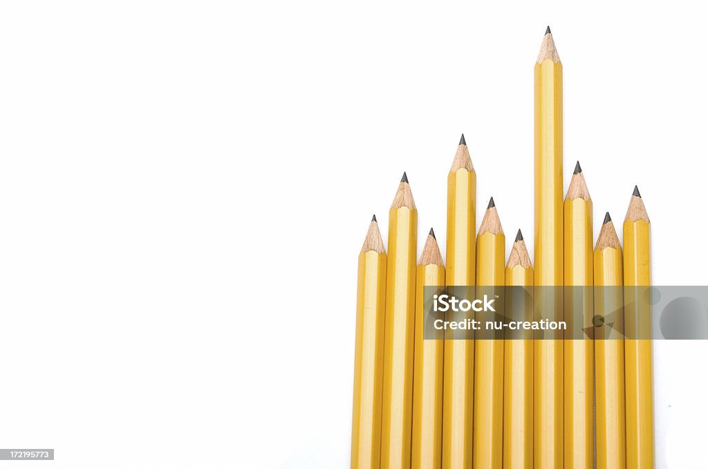 Above all others One pencil sticking out obove the rest. Above Stock Photo