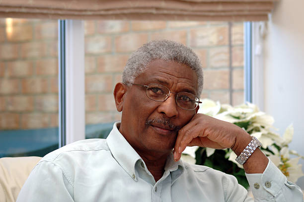 istock Black man sitting pensively in room 172195980