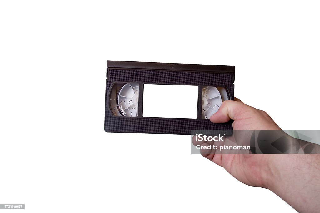 Fita Cassete VHS na mão direita - Foto de stock de Aparelho de videocassete royalty-free