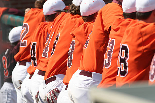 istock Back view of a baseball team in orange uniforms 172196182
