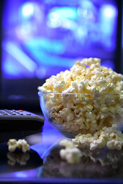 Movie night.Popcorn remote and television. stock photo