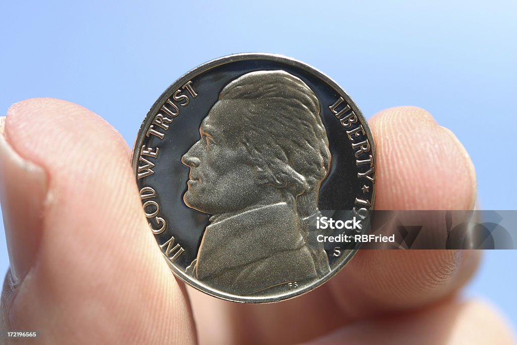 One Nickel a nickel held in a hand Nickel - US Coin Stock Photo