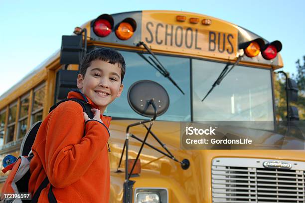 Smiling Boy Near The School Bus Stock Photo - Download Image Now - School Bus, Smiling, Backpack