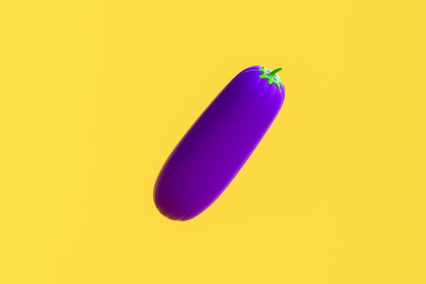 Hand holding a quirky eggplant character featuring googly eyes and a smiling mouth. Fun and whimsical food waste reduction concept.