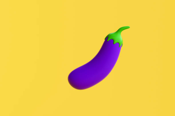 Single eggplant posed creatively against a bright orange backdrop. Unique shape and color highlight the vegetable's aesthetic appeal in a minimalistic style.