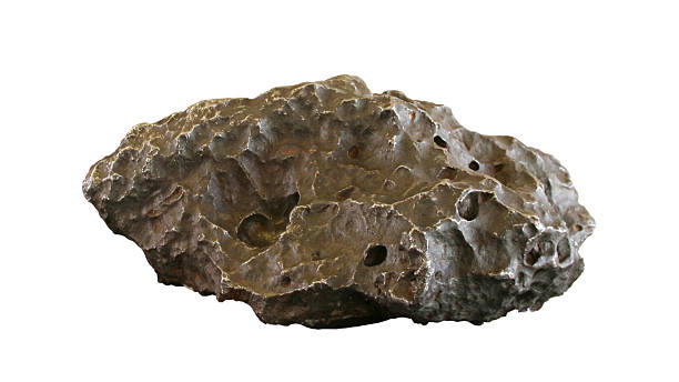 Holsinger Meteorite (path included) "This is a piece of a meteorite that slammed into the Barringer Crater. Due to the use of shallow DOF, the backside of the meteorite is out of focus on the right side. Clipping path included." meteorite photos stock pictures, royalty-free photos & images