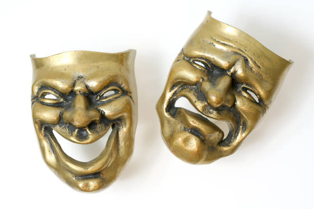 istock Comedy and tragedy brass masks on white background 172197261