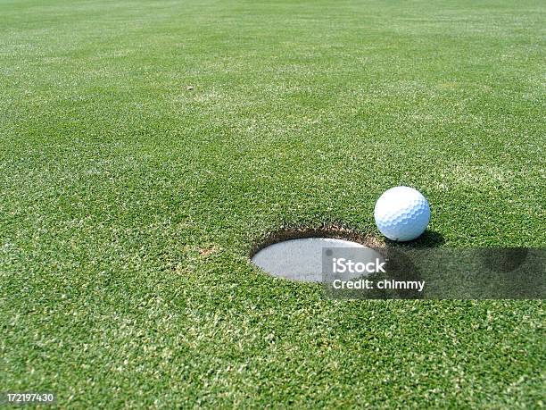 Golf Ball Near The Hole Stock Photo - Download Image Now - Approaching, Closed, Cup