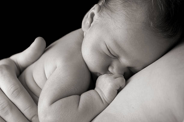 Sleep in Heavenly Peace Newborn baby sleeping peacefully on daddy. arm photos stock pictures, royalty-free photos & images