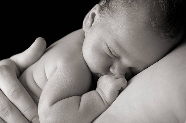 Sleep in Heavenly Peace Newborn baby sleeping peacefully on daddy. kid holding fathers hand stock pictures, royalty-free photos & images