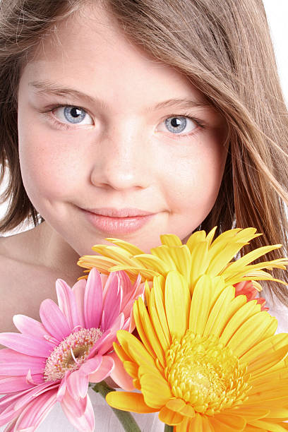 istock Beautiful young girl with flowers 172198165