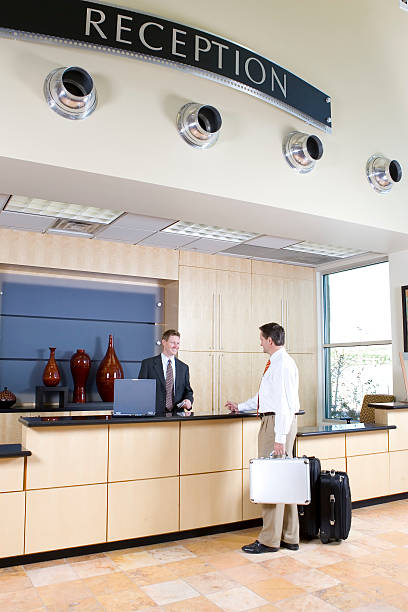 istock Businessman Checking in at the Reception Desk 172198433