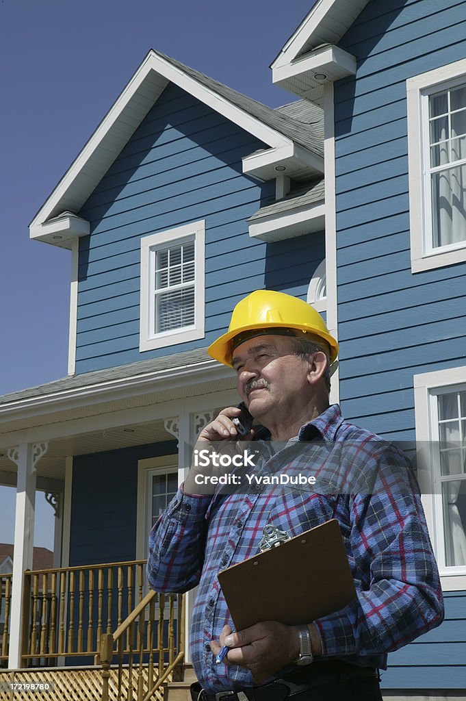 construction foreman over the phone Construction foreman with a pad over the phonePlease see some similar pictures from my portfolio: Adult Stock Photo